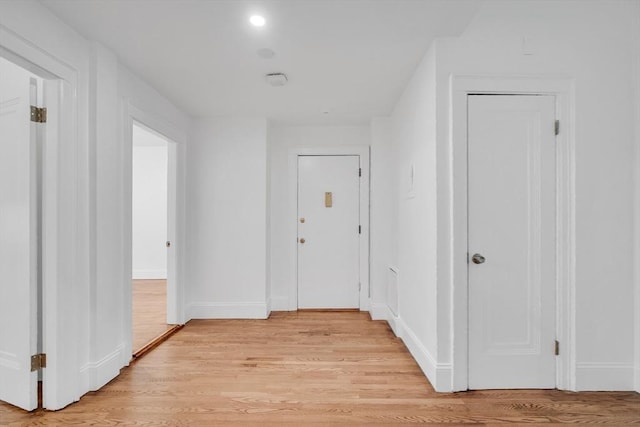 corridor featuring light wood-type flooring