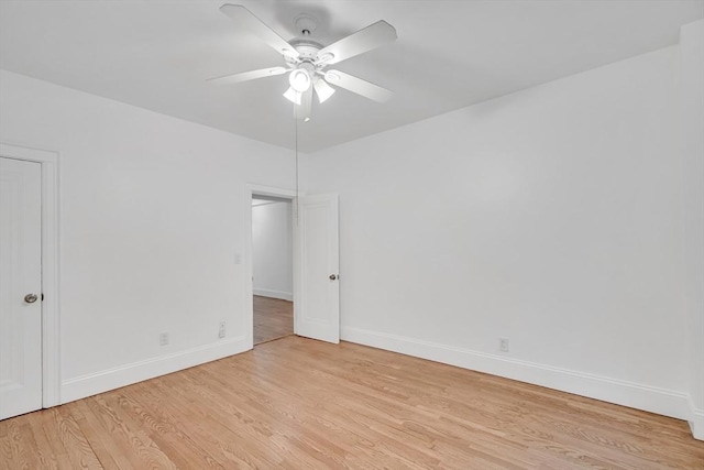 empty room featuring ceiling fan and light hardwood / wood-style floors