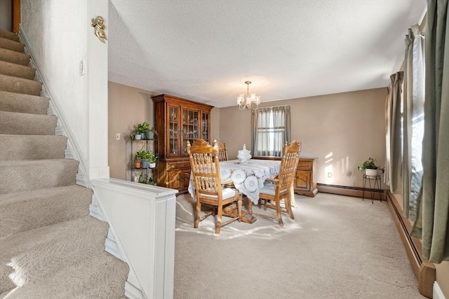 carpeted dining area with a notable chandelier, a textured ceiling, and a baseboard radiator