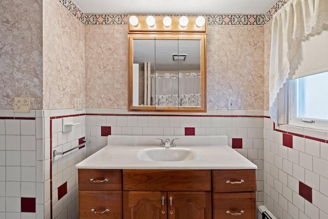 bathroom featuring vanity, tile walls, and a baseboard radiator