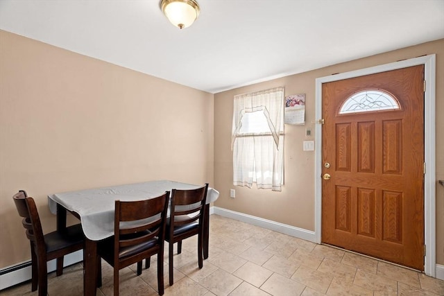 dining space with a baseboard heating unit