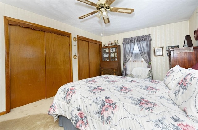 254 Pilgrim Ave, Worcester, MA 01604 - bedroom with carpet flooring, two closets, wallpapered walls, and a ceiling fan