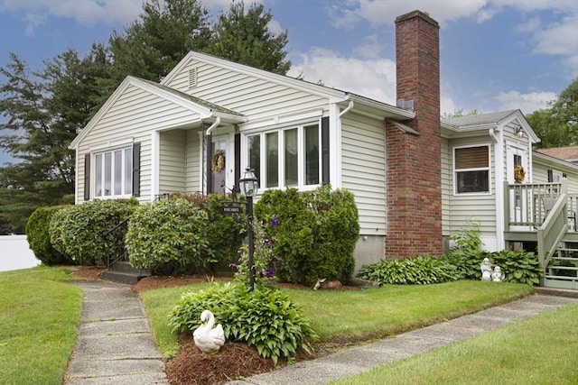 254 Pilgrim Ave, Worcester, MA 01604 - ranch-style house featuring a chimney and a front lawn