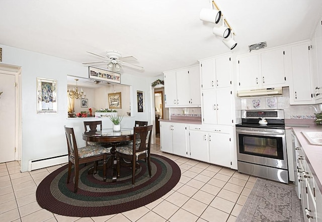254 Pilgrim Ave, Worcester, MA 01604 - kitchen featuring stainless steel electric stove, under cabinet range hood, baseboard heating, light tile patterned flooring, and white cabinetry