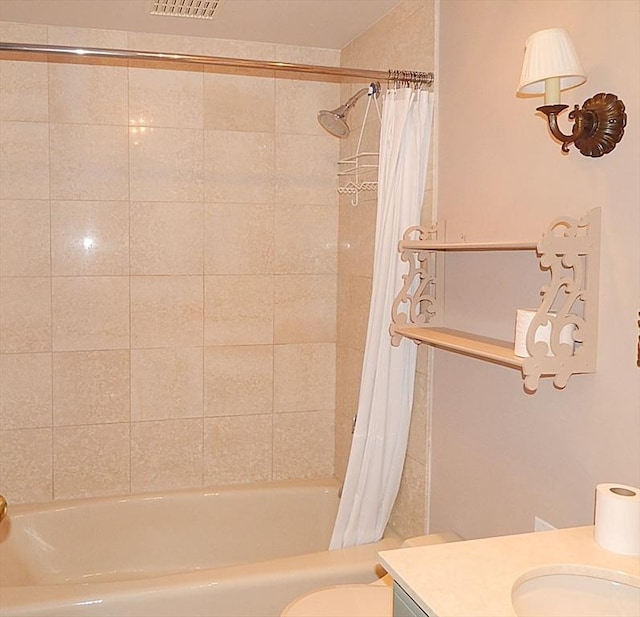 full bathroom with shower / bathtub combination with curtain, vanity, and toilet