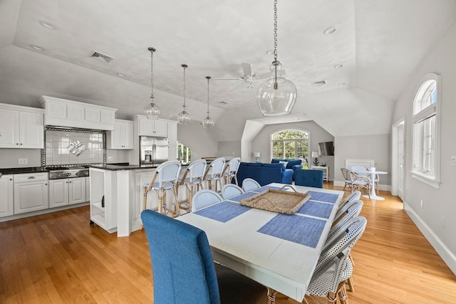 306 Millway, Barnstable, MA 02630 - dining space featuring light wood finished floors, lofted ceiling, ceiling fan, and baseboards