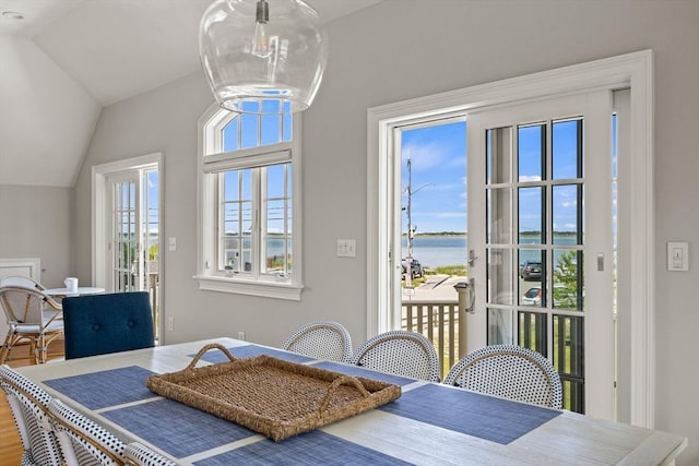 306 Millway, Barnstable, MA 02630 - dining room featuring a water view, a chandelier, lofted ceiling, and wood finished floors