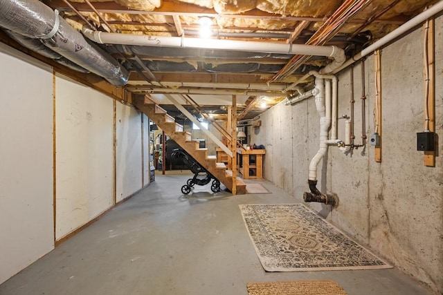unfinished below grade area featuring stairs