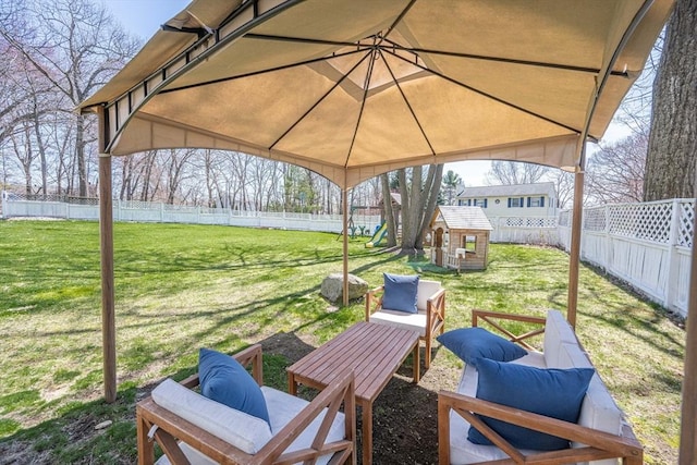 view of patio with a fenced backyard, an outbuilding, and a playground