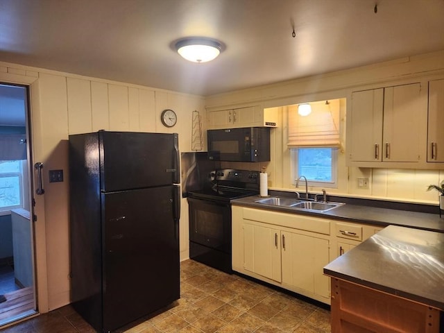 kitchen featuring sink and black appliances