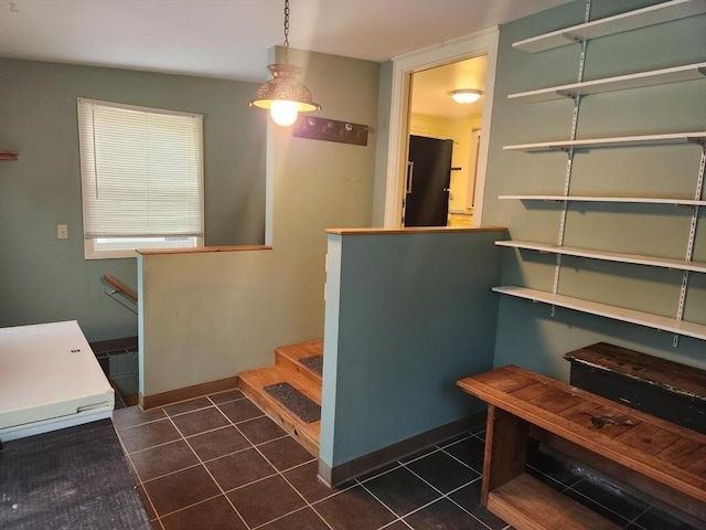 stairway featuring tile patterned floors