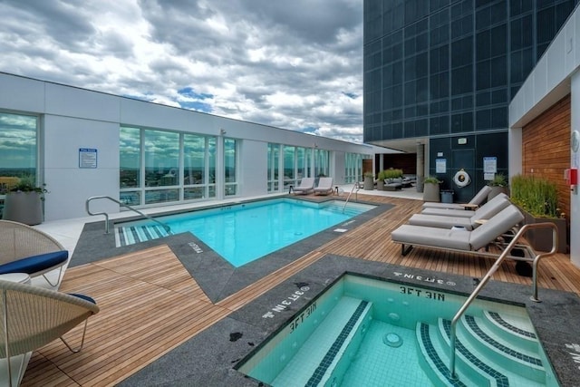 view of swimming pool featuring a community hot tub