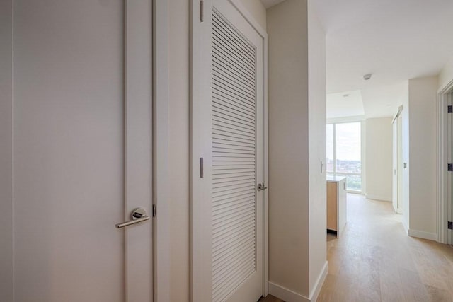 hallway with light wood-type flooring