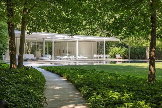 41 Cobbs Hill Rd, Chilmark, MA 02535 - rear view of house with a patio and a lawn
