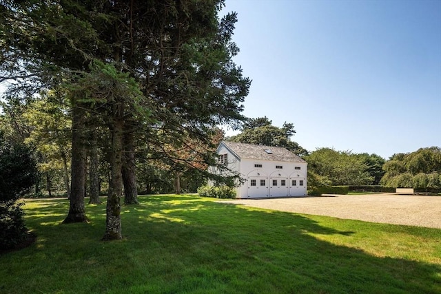 41 Cobbs Hill Rd, Chilmark, MA 02535 - view of green lawn featuring dirt driveway and an attached garage