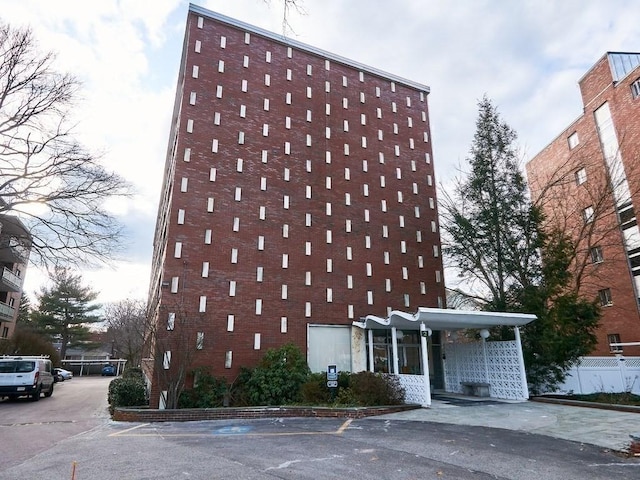 view of building exterior with fence