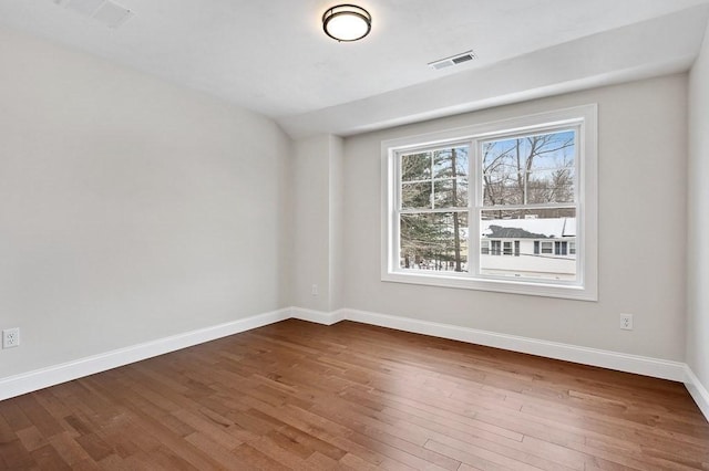 unfurnished room featuring wood-type flooring