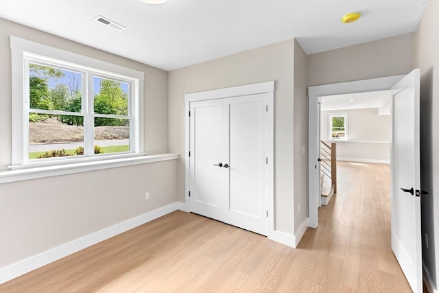 41 Kent St, Brockton, MA 02302 - unfurnished bedroom with light wood finished floors and multiple windows