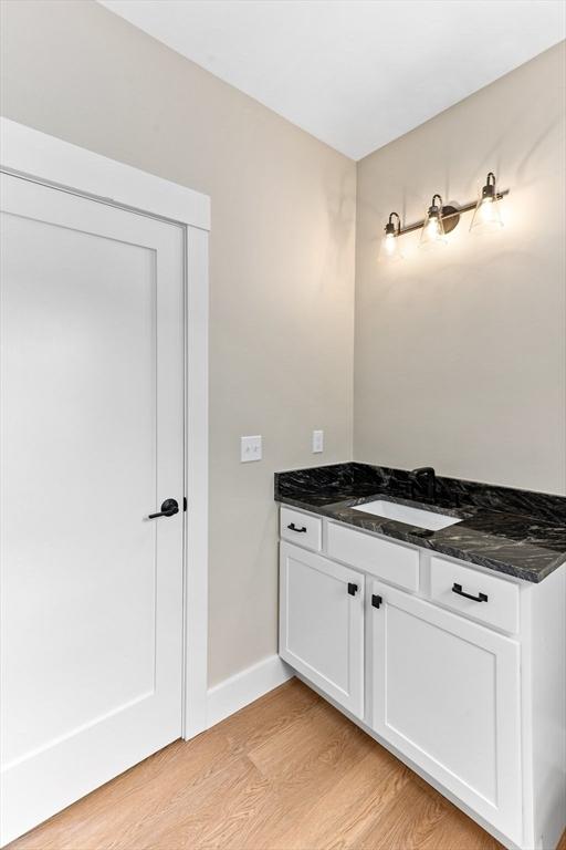 41 Kent St, Brockton, MA 02302 - bathroom featuring wood finished floors and vanity