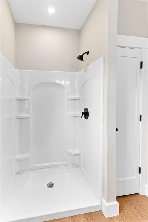 41 Kent St, Brockton, MA 02302 - bathroom with a shower stall and wood finished floors