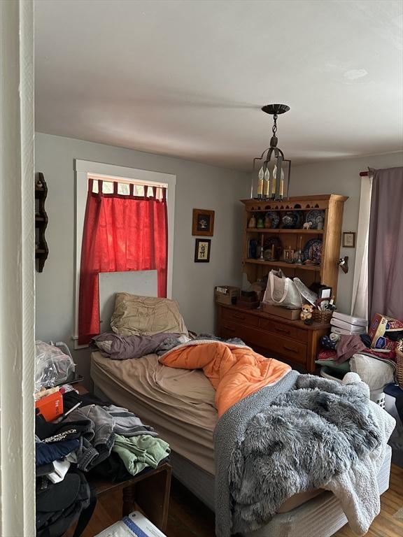 bedroom with hardwood / wood-style floors