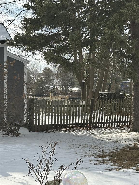 view of snow covered gate