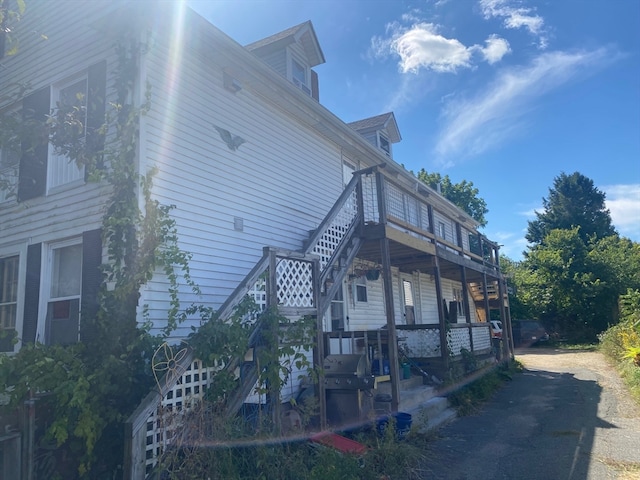 view of home's exterior with a wooden deck