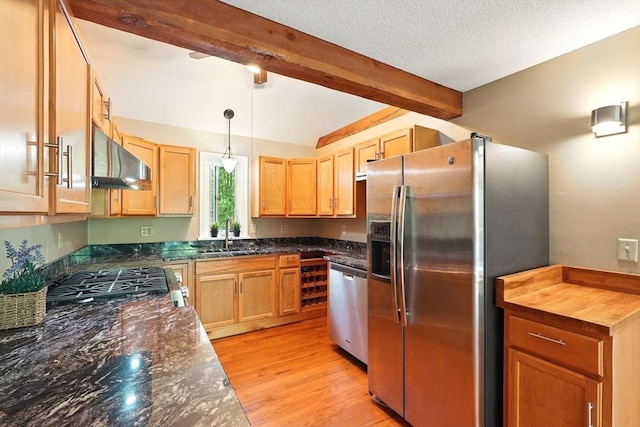 237 Shutesbury Rd, Amherst, MA 01002 - kitchen featuring stainless steel appliances, a sink, beam ceiling, under cabinet range hood, and light wood-type flooring