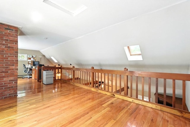 237 Shutesbury Rd, Amherst, MA 01002 - additional living space featuring a skylight, wood finished floors, and vaulted ceiling