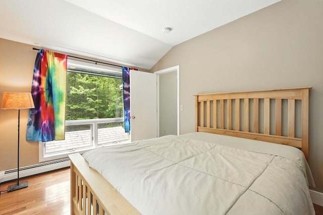 237 Shutesbury Rd, Amherst, MA 01002 - bedroom featuring vaulted ceiling, wood finished floors, and a baseboard radiator