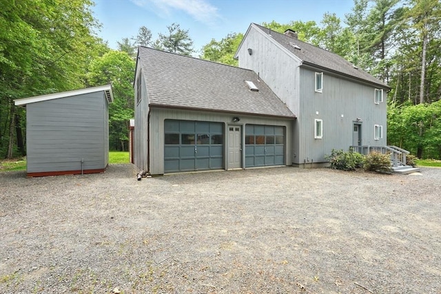 237 Shutesbury Rd, Amherst, MA 01002 - view of side of home featuring a shingled roof and a chimney