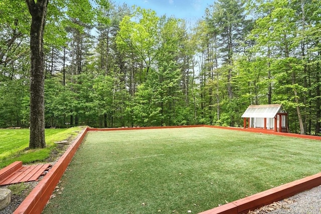 237 Shutesbury Rd, Amherst, MA 01002 - view of grassy yard featuring a game area and an outdoor structure