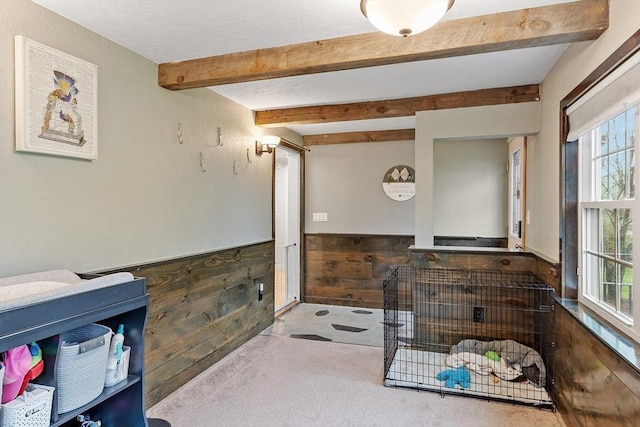 sunroom / solarium with plenty of natural light and beamed ceiling