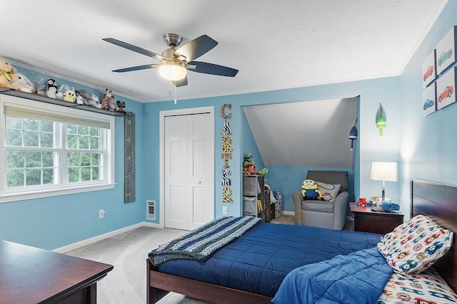 carpeted bedroom with baseboards, ceiling fan, and heating unit