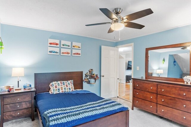 bedroom with carpet, ceiling fan, and crown molding