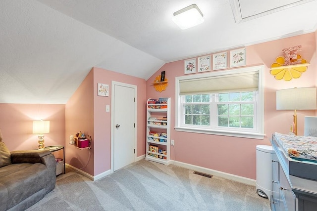 rec room featuring light colored carpet, lofted ceiling, and baseboards