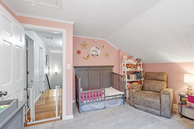 carpeted bedroom featuring baseboards, crown molding, and vaulted ceiling