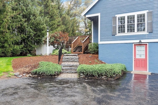 view of exterior entry featuring stucco siding
