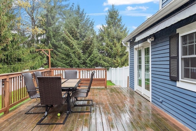 wooden terrace featuring outdoor dining area