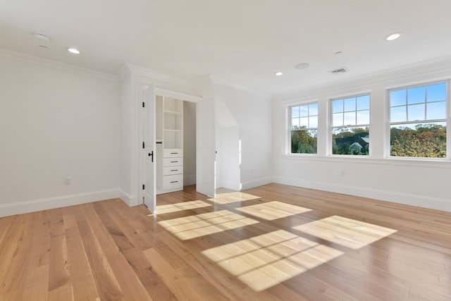 unfurnished bedroom featuring light hardwood / wood-style flooring and crown molding