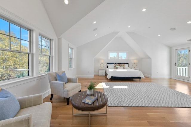 bedroom featuring light hardwood / wood-style flooring and multiple windows