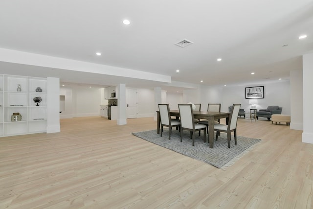 dining space with light wood-type flooring