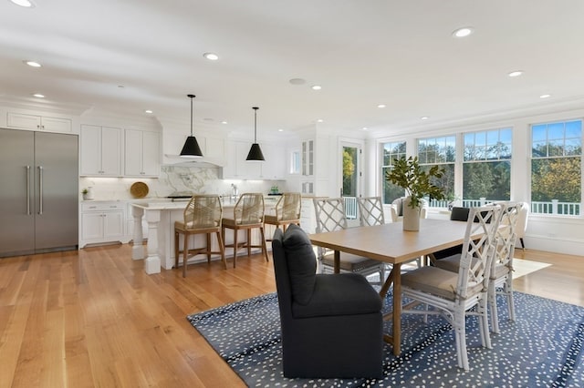 dining space with light wood-type flooring