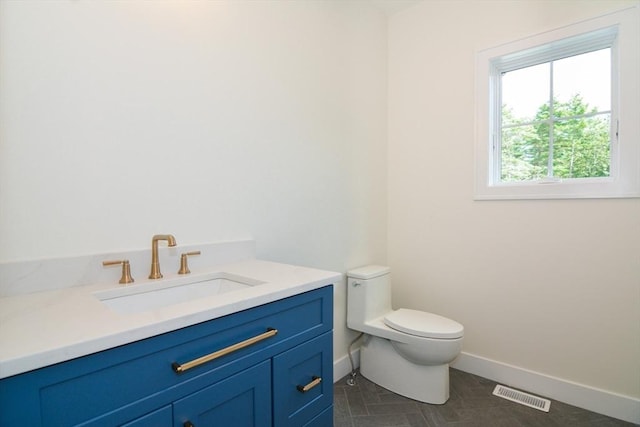 bathroom with vanity and toilet