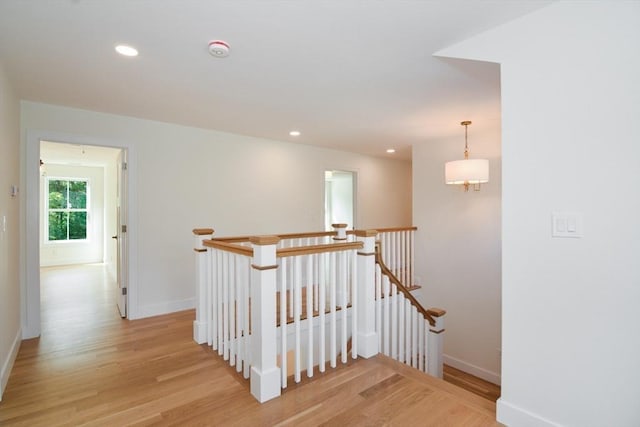 stairs with hardwood / wood-style floors