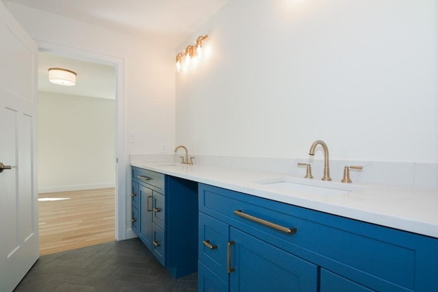 bathroom featuring vanity and parquet floors