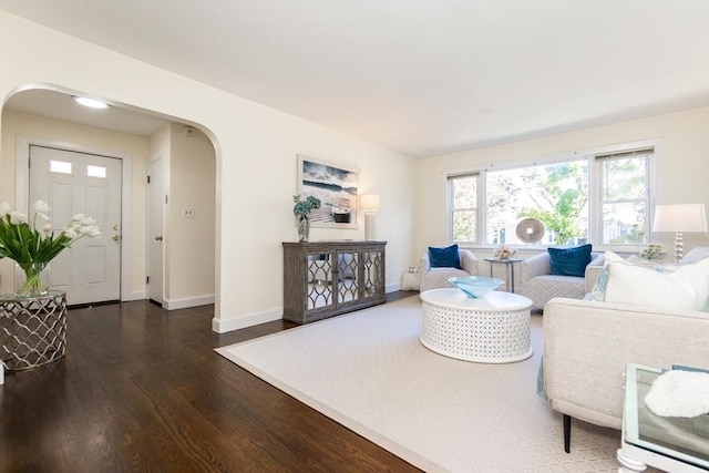 living room with dark hardwood / wood-style floors