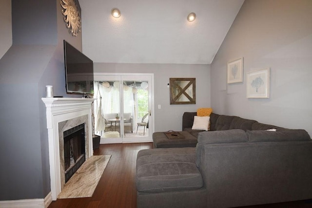 1559 Bay St Unit 53, Taunton, MA 02780 - living room featuring vaulted ceiling, wood finished floors, and a high end fireplace