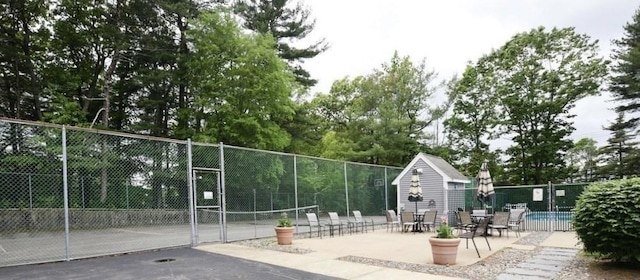1559 Bay St Unit 53, Taunton, MA 02780 - view of property's community with a gate, view of scattered trees, and an outdoor structure