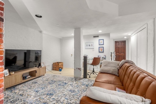 living room featuring recessed lighting and visible vents